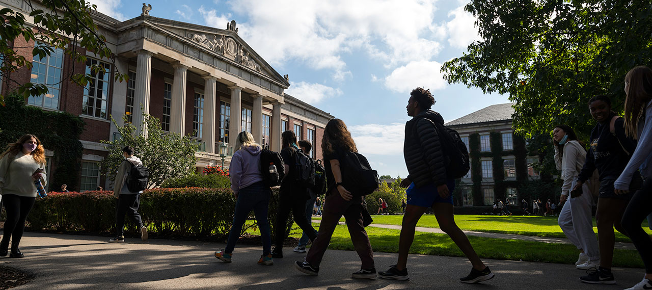 Students walking across the Eastman Quad.