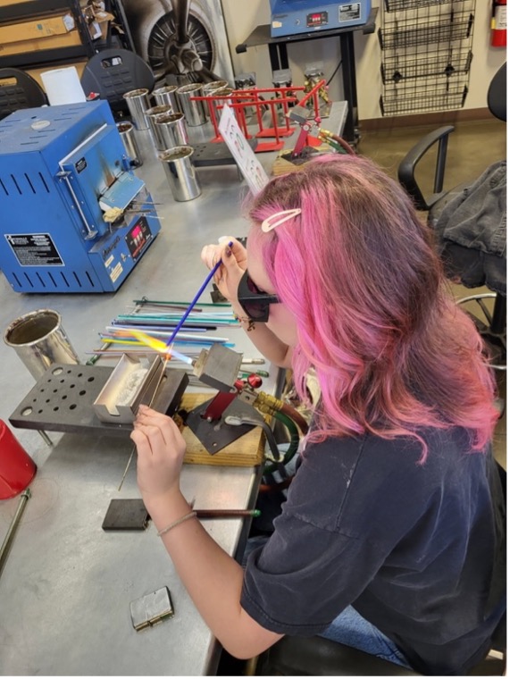 An overhead view of someone working on a project.