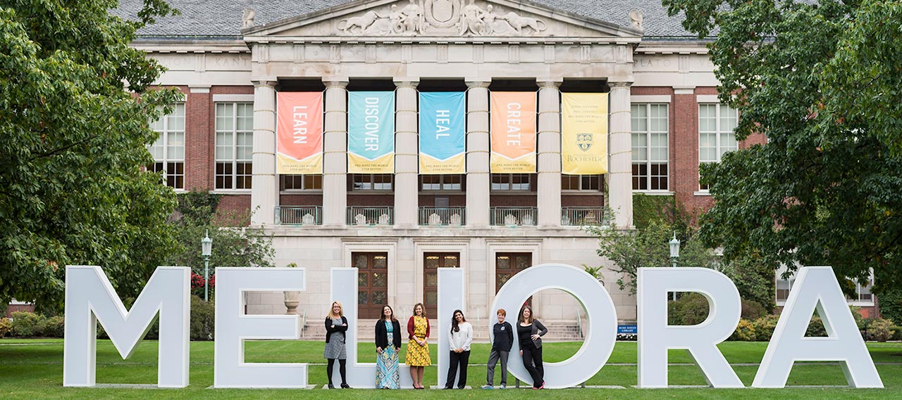 Grad Studies staff in front of Rush Rhees library.