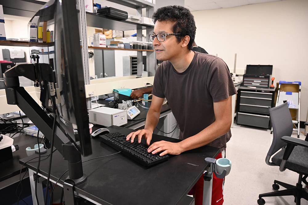 A student working at a computer station.