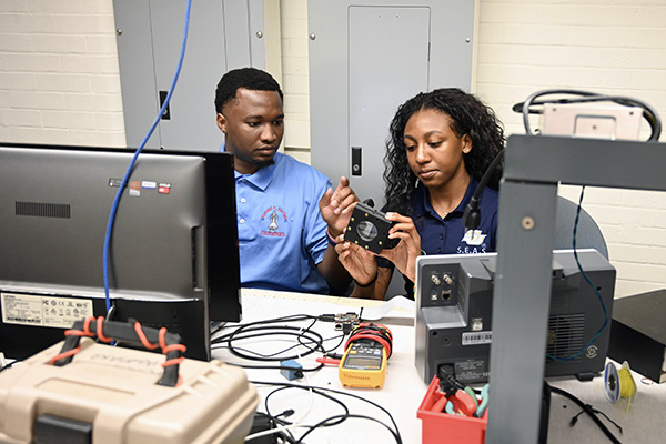 Two students working together on a project.