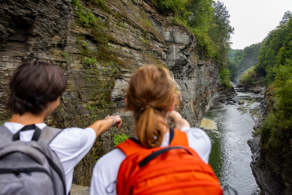 Two students look out over a gorge at Letchworth State Park