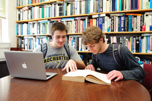 two students at a laptop