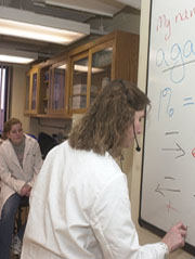staff member at the white board