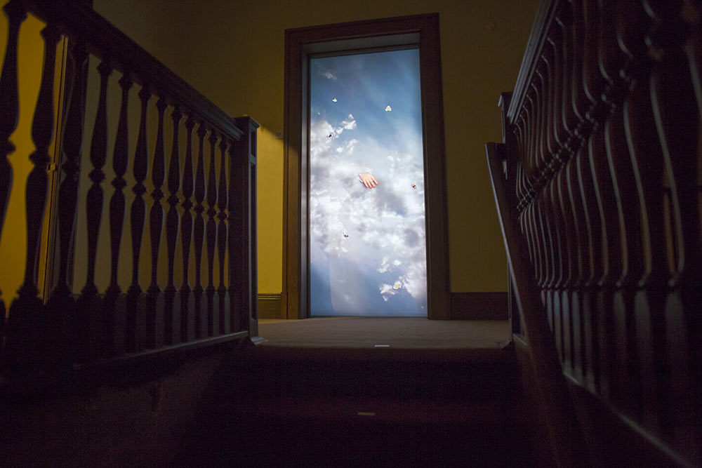 lighted doorway with a celestial image