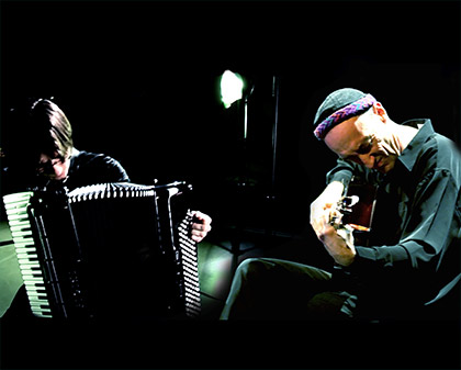 musicians playing accordion and guitar