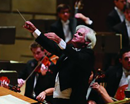 conductor with orchestra