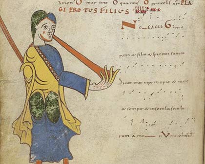 illustration of a medieval scribe, next to old musical notation