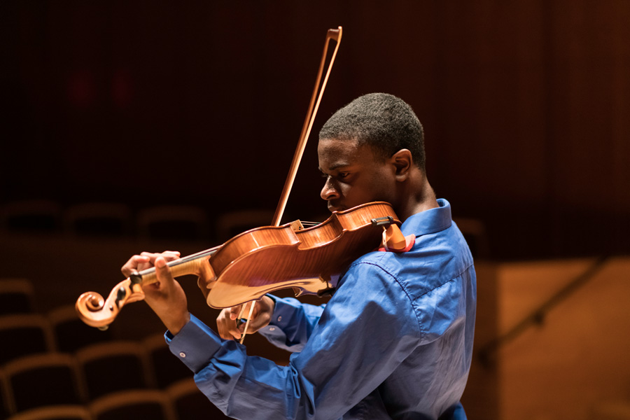 Violinist performing solo at the University of Rochester Eastman School of Mucis