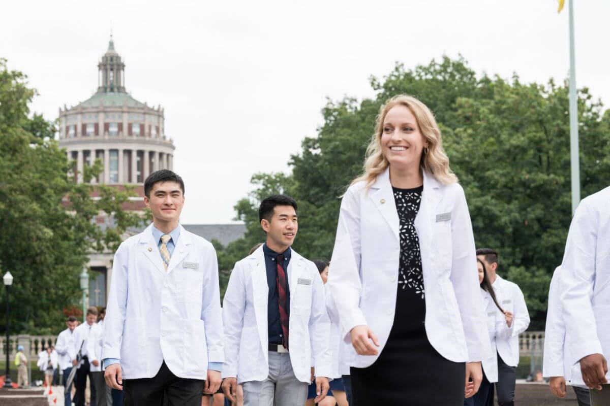 Members of the class of '22 leave Eastman quad after posing for a class photo following the University of Rochester School of Medicine & Dentistry holds its Annual Dr. Robert L. & Lillian H. Brent White Coat Ceremony.