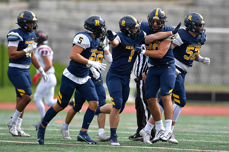 U of R football players on the field.