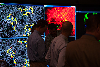 Visitors attend a preview of the Visualization-Innovation-Science-Technology-Application (VISTA) Collaboratory, University of Rochester's 1,000-square-foot data visualization lab located in Carlson Library.
