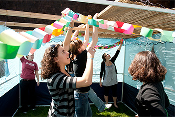 Students decorate a sukkah, a temporary dwelling built during the Jewish holiday of Sukkot.