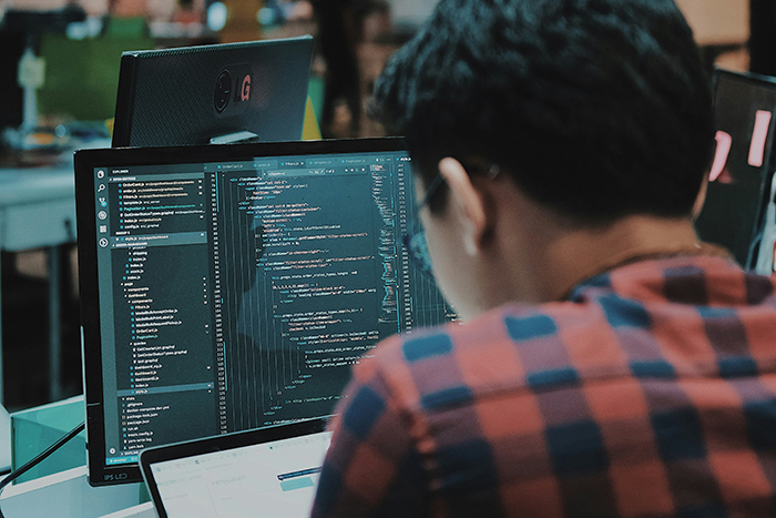 A person processing data on a computer.