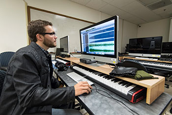 A student working in a music studio