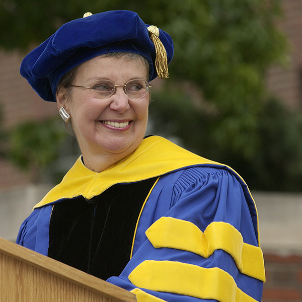 Suzanne wearing a cap and gown.