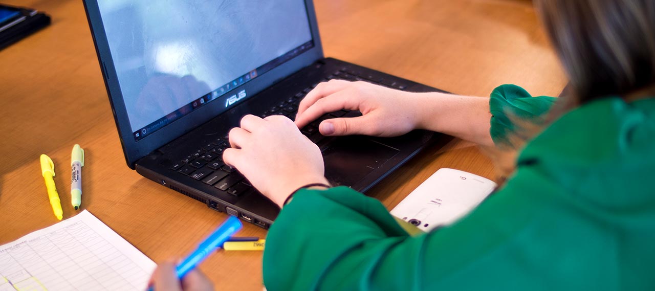 A student working on a computer.