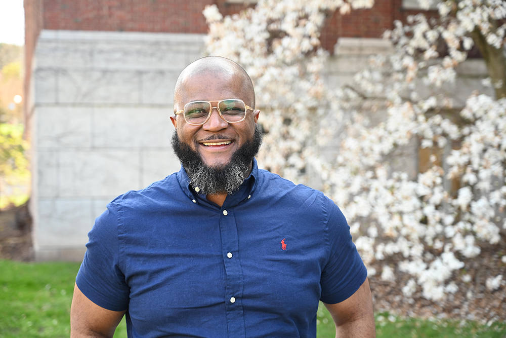 Williams standing on the University of Rochester campus.