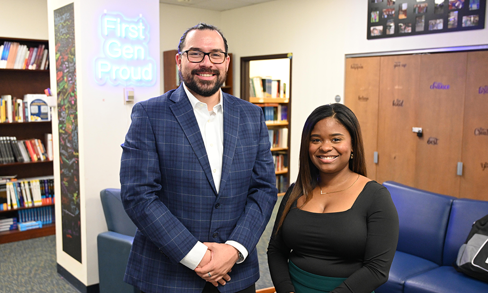 Two people smiling at the camera.