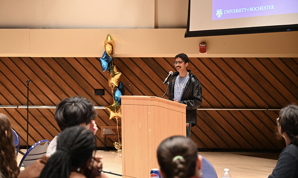 A student standing behind a podium.