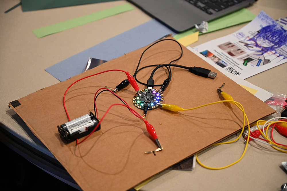 The CPX microcontroller programed to light up.