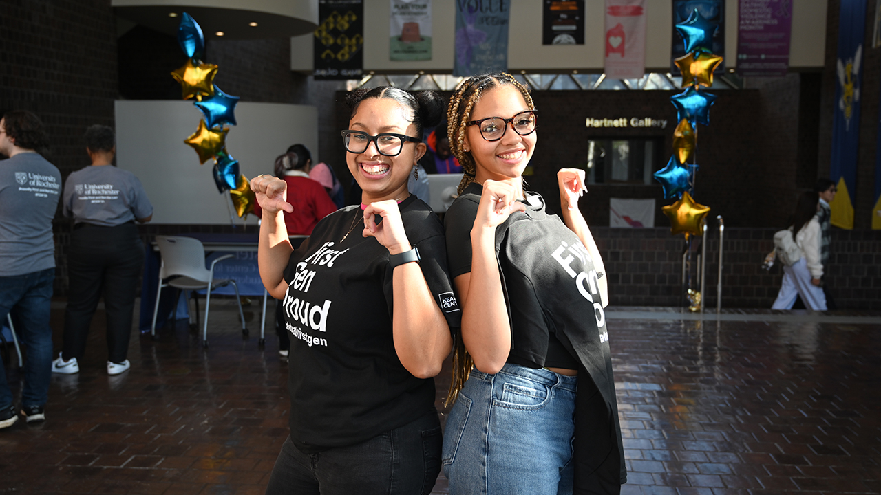 Two students hold up their First-Gen Proud t-shirts during First-Gen Fun Day November 4, 2025. Photo: Alexa Olson, University of Rochester