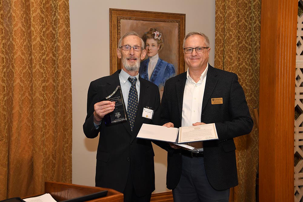 Dr. Frohman receiving the James S. Armstrong award.