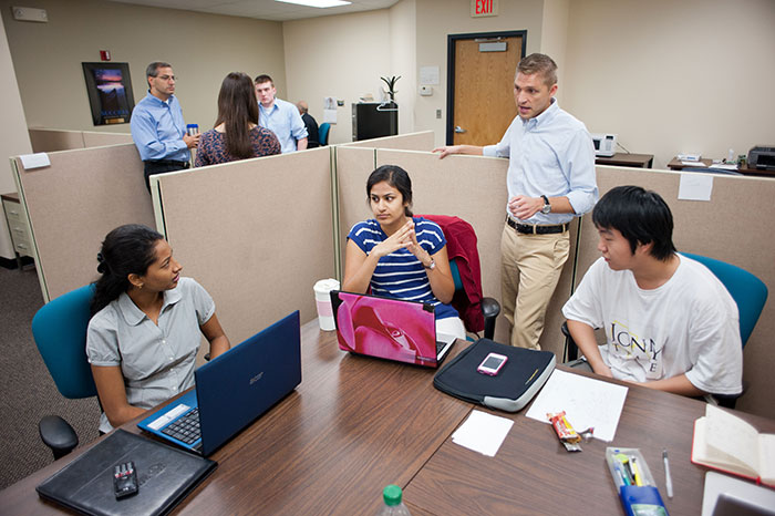 Students meeting with an advisor