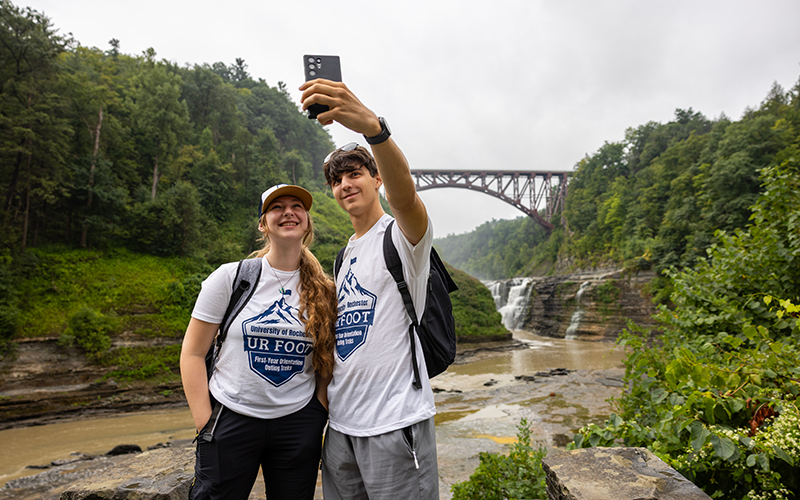 Trek Leaders snap a selfie in front of the bridge in Letchworth State Park during a trek