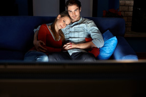 Couple Cuddling in Front of TV
