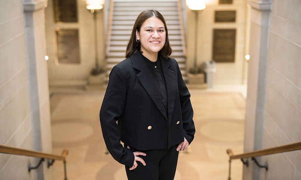 Mara Criollo-Rivera ’25 (business entrepreneurship (BS), digital media studies (BA), is photographed in Rush Rhees Library.