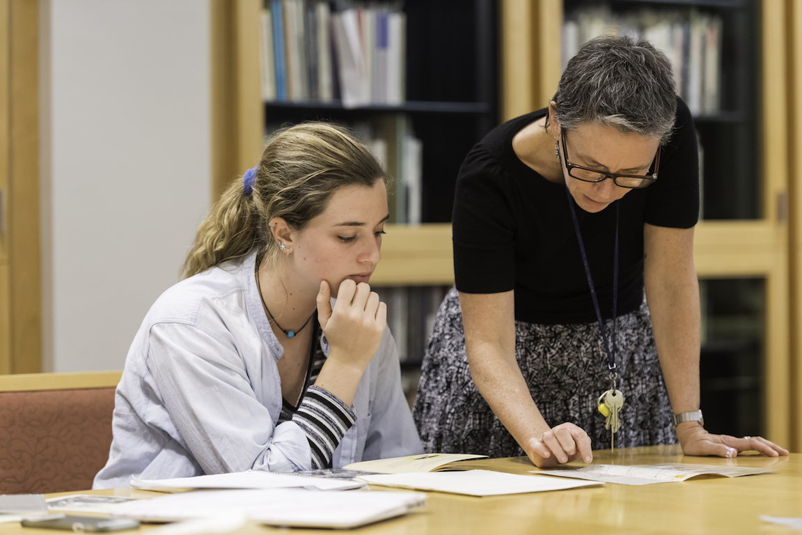 A professor helping a student.