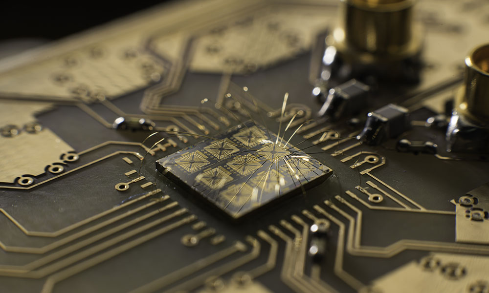 Closeup of semiconductor chip attached to circuit board.