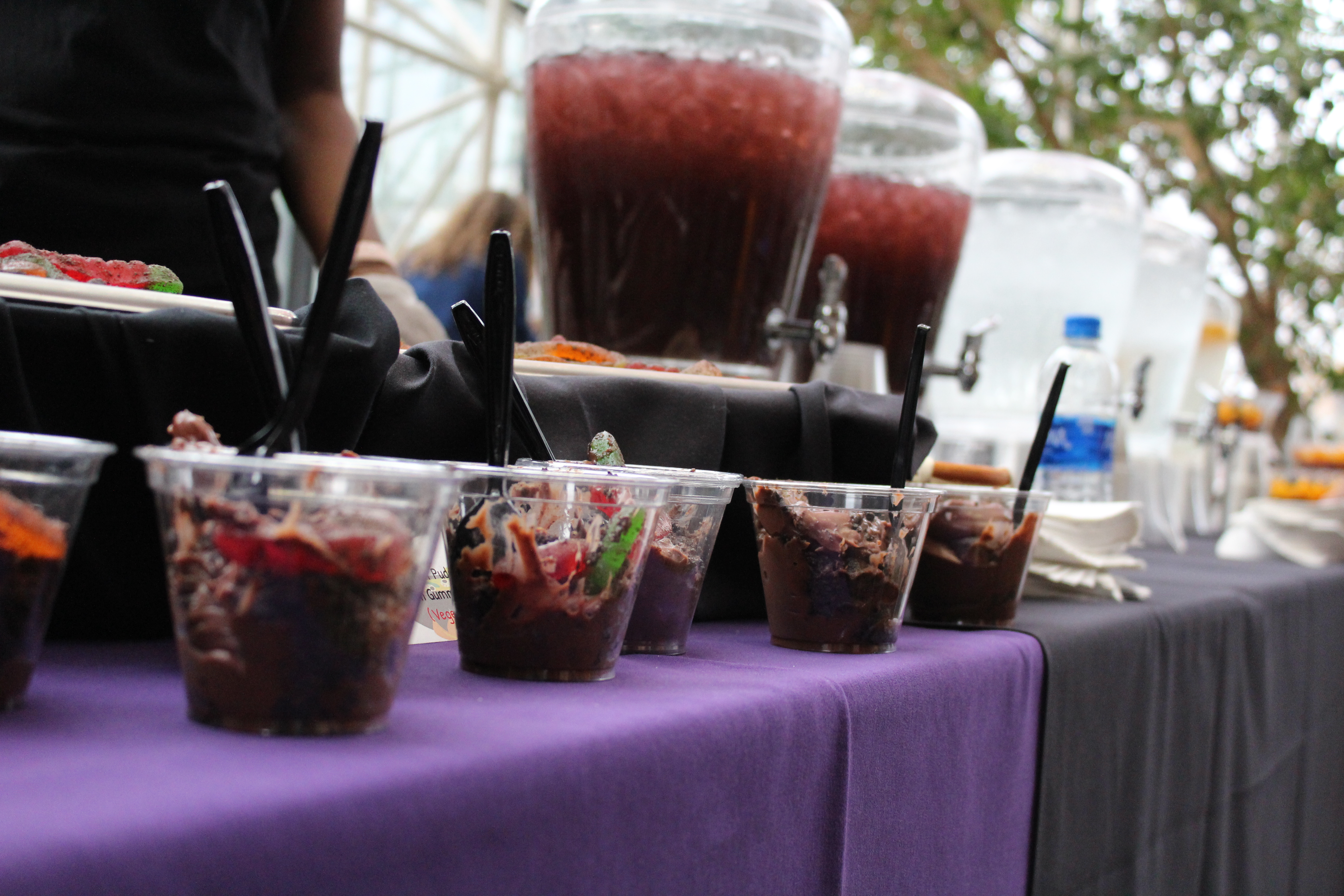 decorative picture of small plastic cups full of a dark liquid