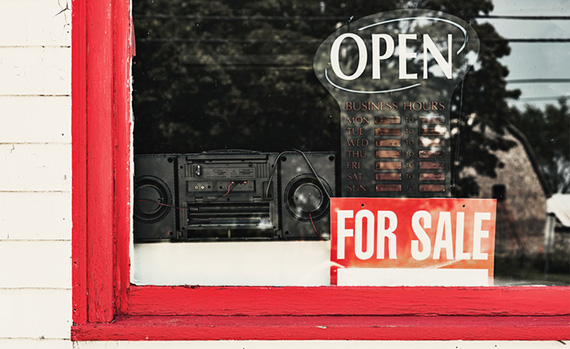 for sale sign in store window
