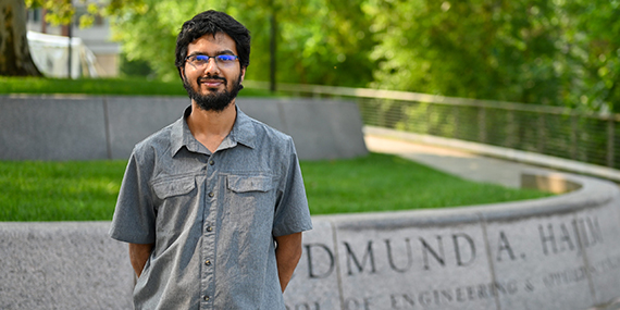 Md. Saiful Islam stands in front of the Hajim quadrangle.