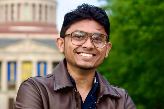 Masum Hasan poses in front of the Rush Rhees Library