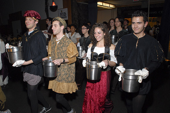 Four college students dressed in medieval clothing