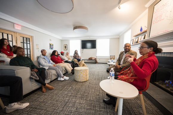 Author and journalist Rachel Swarns, accompanied by Jeffrey McCune, meets with students in Douglass Leadership House