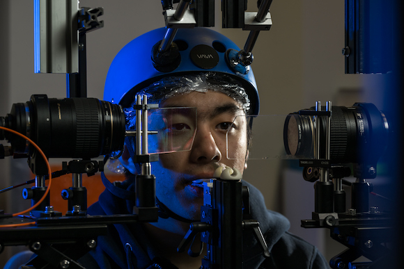 Student uses an an apparatus used to track eye movements