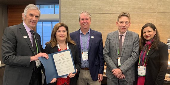 Five researchers including Susana Marcos, second from the left, pose with a certificate noting the 2023 Mamalis Award.
