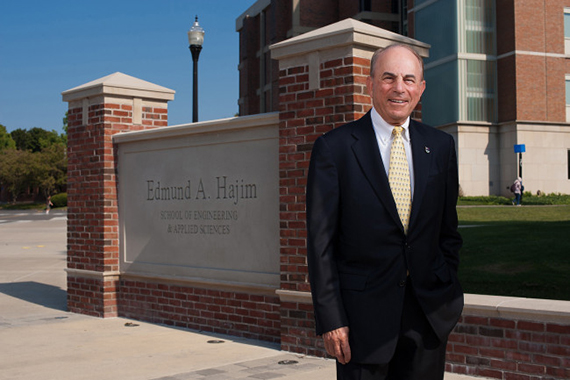 Ed Hajim stands in front of the Hajim Quad.