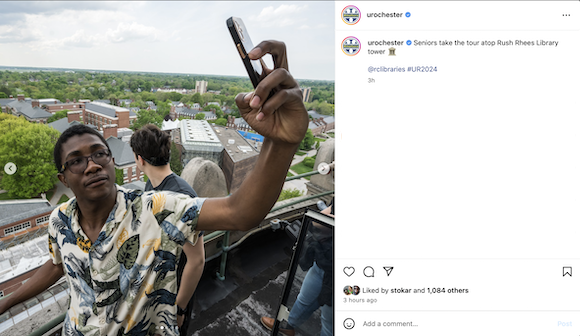 Screenshot of the University of Rochester Instagram with a student taking a selfie atop the library tower