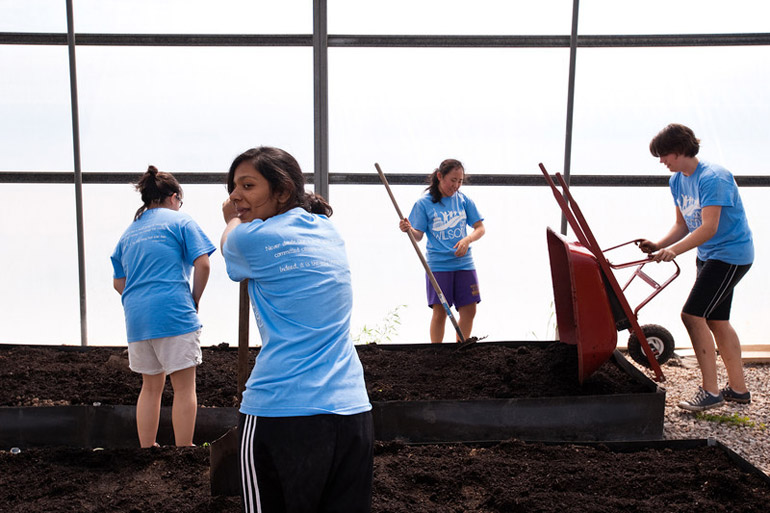 students work at farm