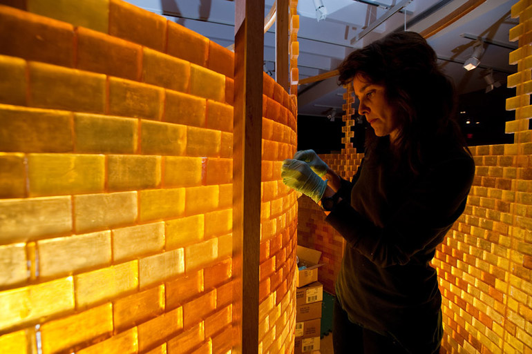 artists constructs sculpture made of soap