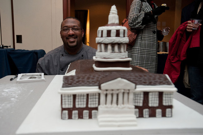 Dana Herber poses with Rush Rhees Library cake
