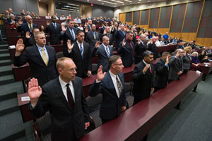 police officers being sworn in at ceremony