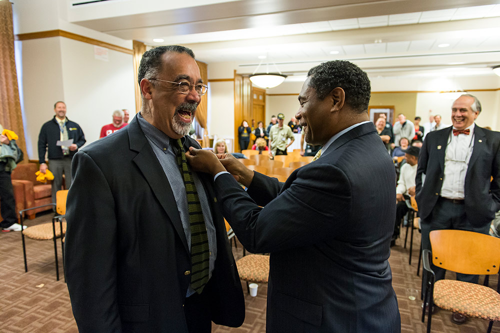 Paul BUrgett receives his veterans pin from Tony Kinslow