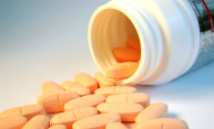 pills spilling out of a bottle