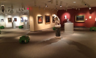 photo shows fans and other equipment in art gallery with sculptures